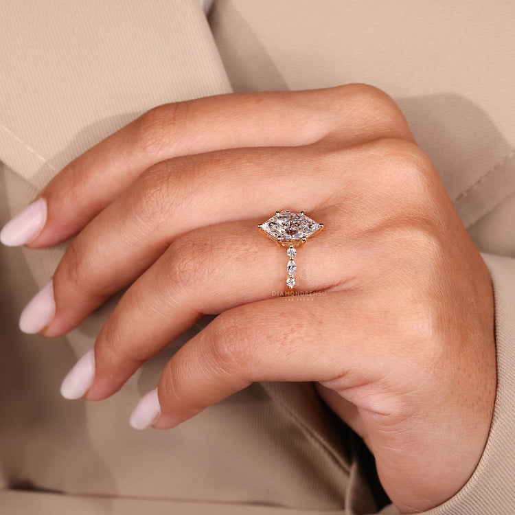 Seven diamond ring with shared prong setting style.