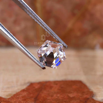 A lab grown loose diamond with a precise hexagon step cut shape.