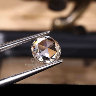 The lab created diamond has a round rose cut shape.