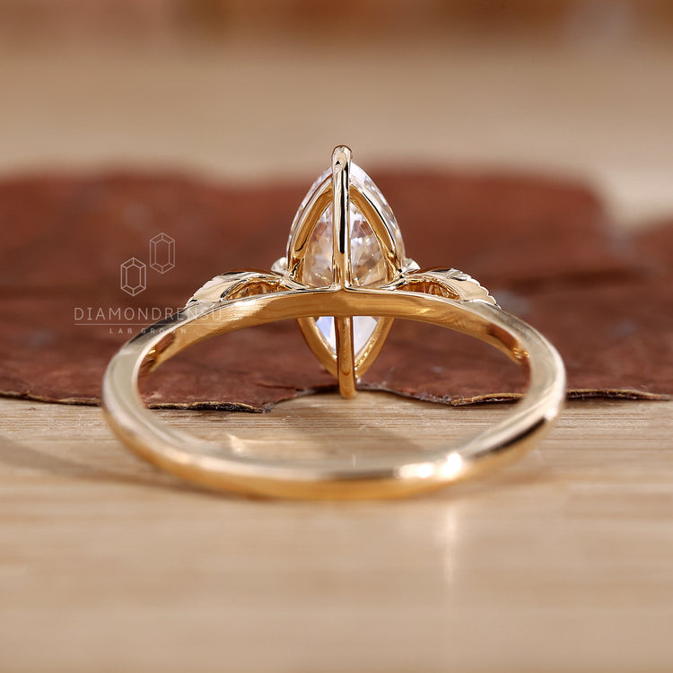 Compass prong setting on a marquise diamond ring for style.