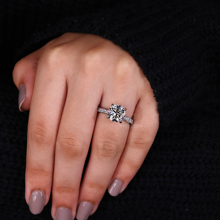 Claw Prong Setting holding a sparkling round diamond.
