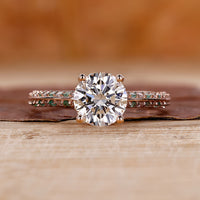 Round diamond ring with stunning pave diamond accents in a modern design.