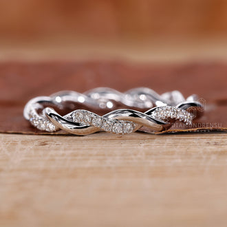 Handmade jewelry featuring a round diamond wedding band.
