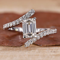 Emerald cut diamond engagement ring with a sleek design.