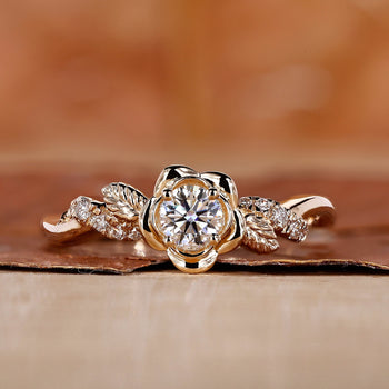 Handmade nature-inspired round diamond engagement ring with floral design and twisted pave band