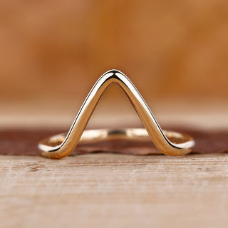 Gold chevron wedding band with a sleek design