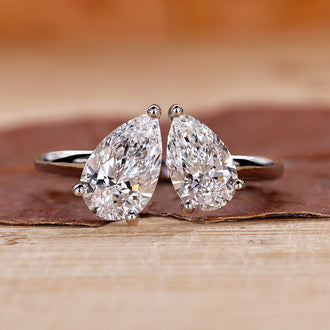 Toi et Moi Engagement Ring featuring a stunning pear shaped diamond.