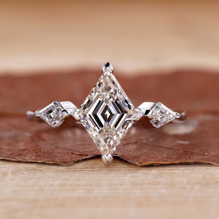 3 Stone Diamond Ring with brilliant diamonds in a prong setting.