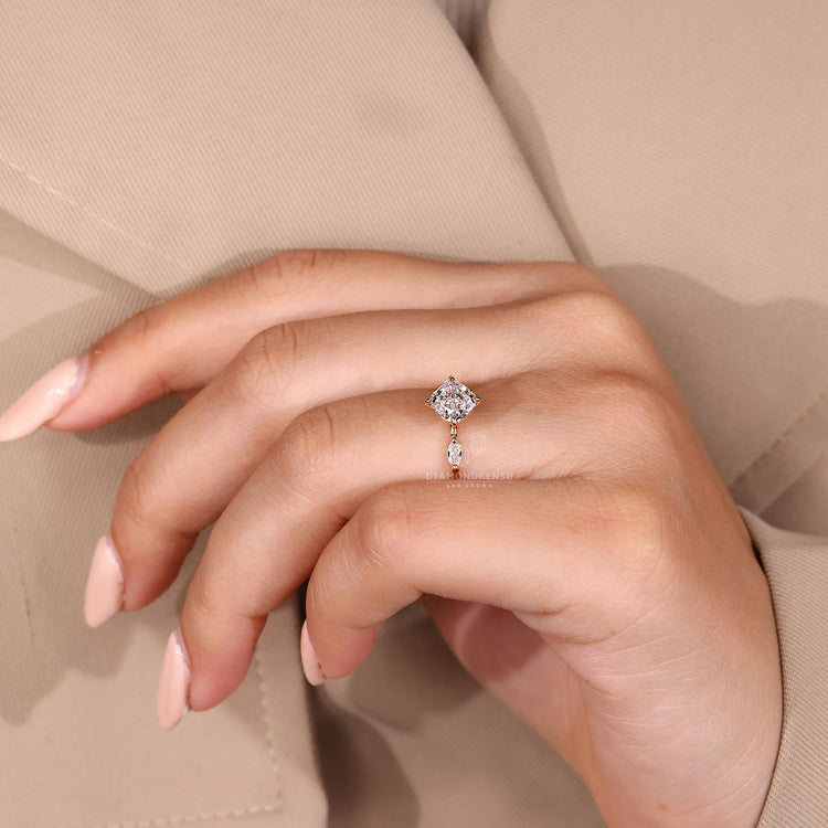 Compass prong setting holds cushion diamond.