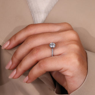 IGI certified handmade ring featuring round cut diamond and cathedral setting.