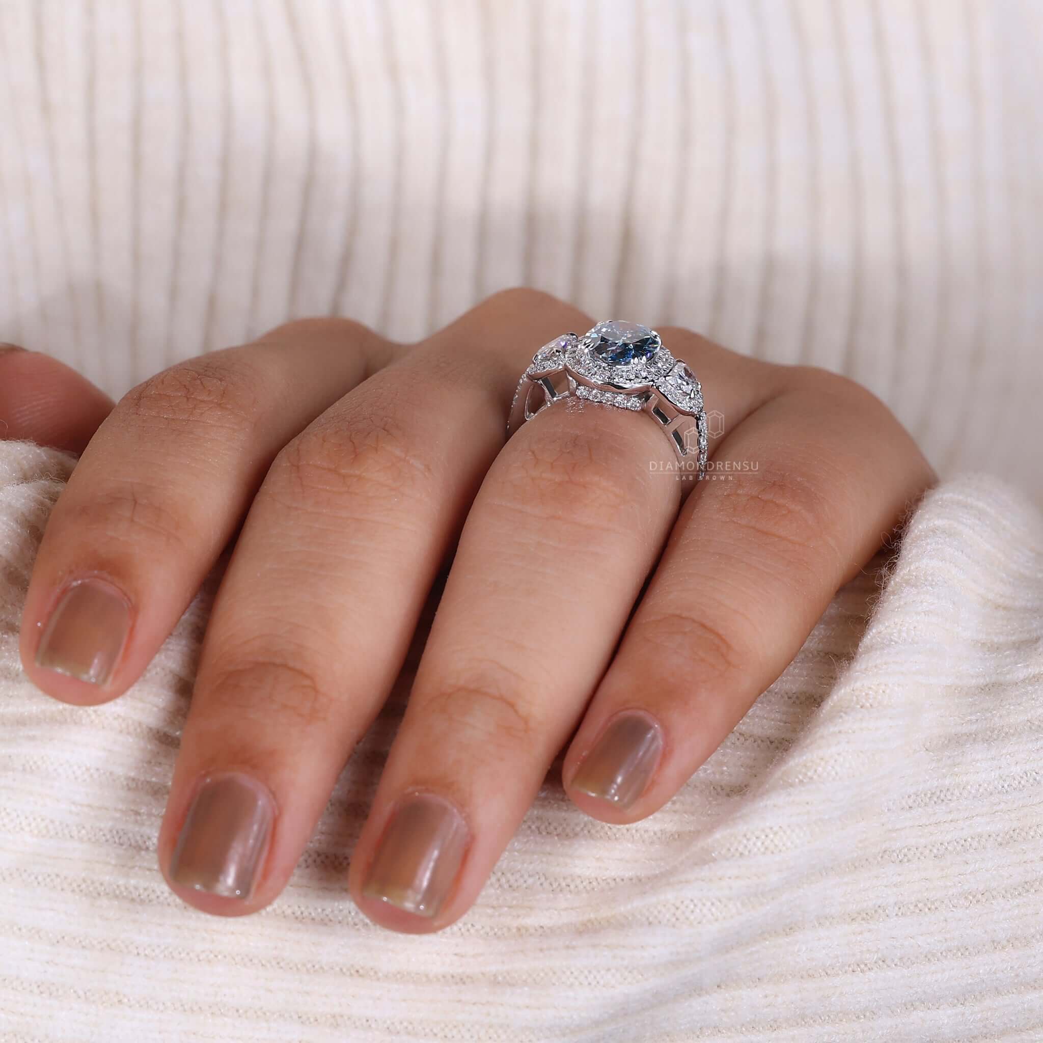 Detail shot of Custom Engagement Ring design on hand