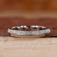 White gold wedding band with round diamond wedding band.