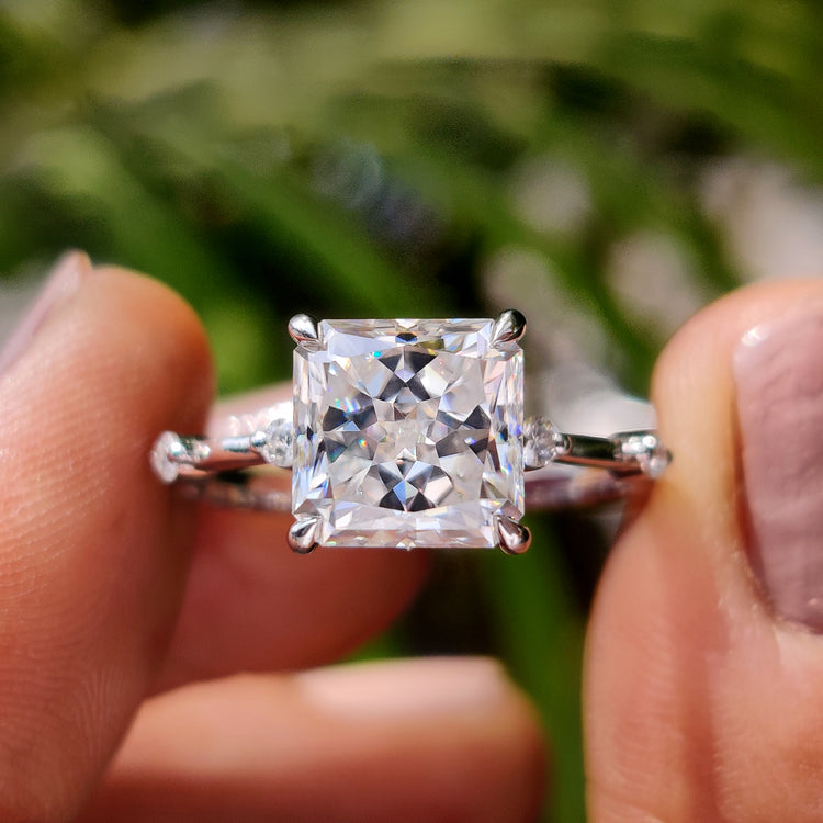 Radiant cut engagement ring with bold center stone.