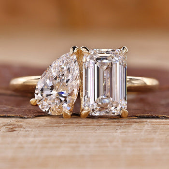 Toi et moi gold ring with pear and emerald cut diamonds.