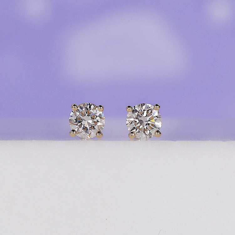 Round diamond earrings with elegant sparkle, perfect for everyday wear.