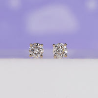 Round diamond earrings with elegant sparkle, perfect for everyday wear.