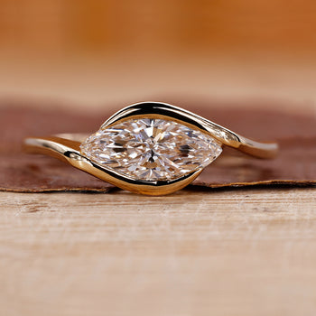 Marquise Diamond Engagement Ring on a sleek band for a modern proposal.