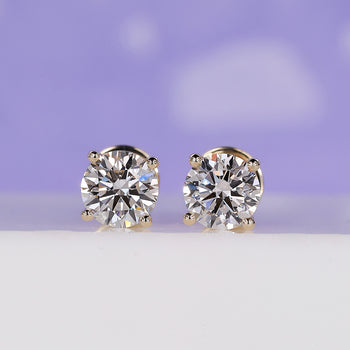 Elegant yellow gold and diamond earrings for timeless style.