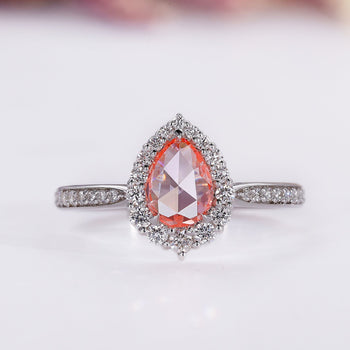 Pear halo engagement ring in white gold.