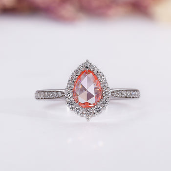 Pear halo engagement ring in white gold.