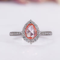 Pear halo engagement ring in white gold.