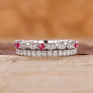 Ruby and diamond wedding band with round diamonds set in white gold.