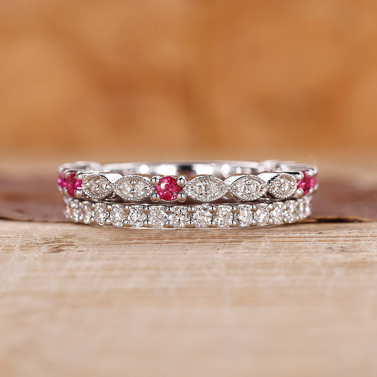 Ruby and diamond wedding band with round diamonds set in white gold.
