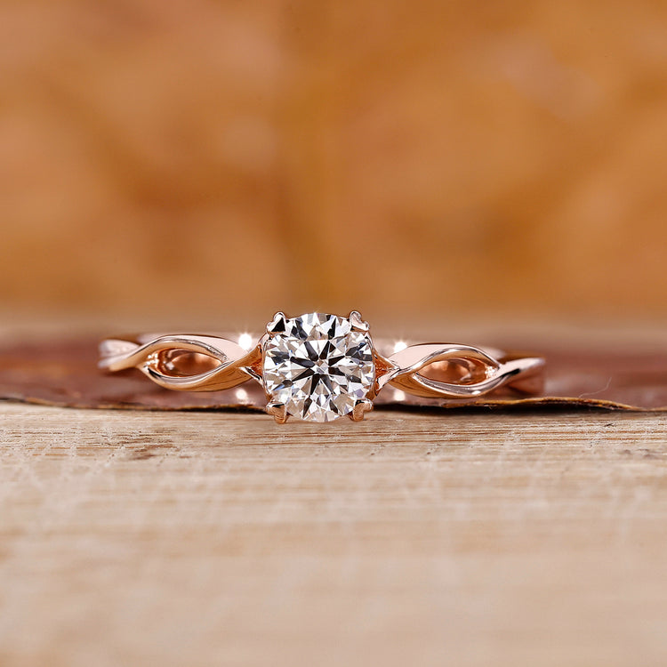 Rose Gold Solitaire Engagement Ring with a round diamond center.