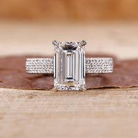 Emerald cut diamond ring with a sleek design and brilliant sparkle.