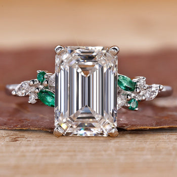 3CT Emerald Cut Diamond Ring with Marquise and Round Side Stones for a sophisticated, elegant look.
