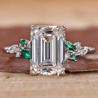 3CT Emerald Cut Diamond Ring with Marquise and Round Side Stones for a sophisticated, elegant look.