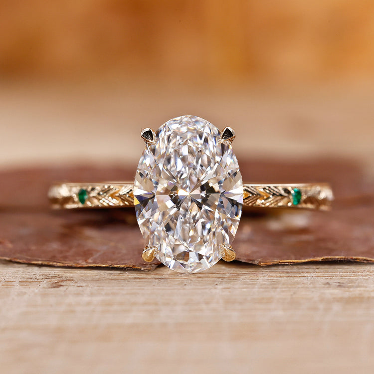 Oval hidden halo engagement ring with a sparkling center diamond.