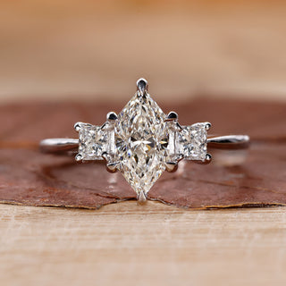 3 Stone Diamond Ring with stunning princess cut side stones.