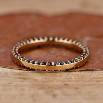 Handmade jewelry featuring a sleek eternity wedding band.