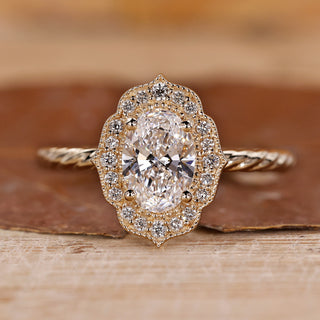 Vintage oval diamond ring with intricate detailing.