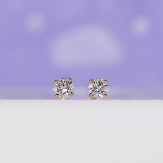 Round Diamond Stud Earrings 0.36 TCW with a classic design.