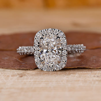 Halo oval ring engagement with stunning three side pave design.