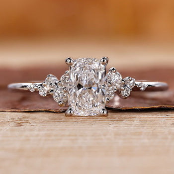 Elongated cushion cut diamond ring with a sparkling lab grown diamond in a prong setting.