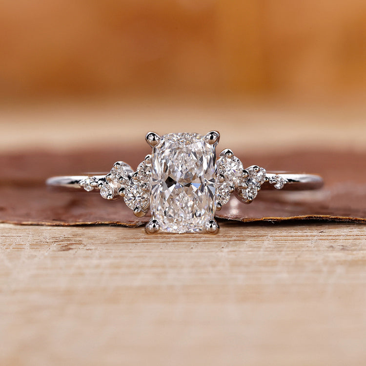 Elongated cushion cut diamond ring with a sparkling lab grown diamond in a prong setting.