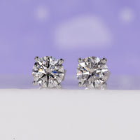 2 Carat Diamond Earrings with a timeless round diamond design in a 4 prong setting.