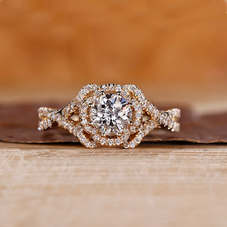 Halo diamond engagement ring with Jubilee cut diamond and twisted pave setting.