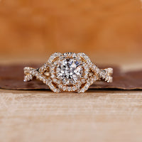 Halo diamond engagement ring with Jubilee cut diamond and twisted pave setting.
