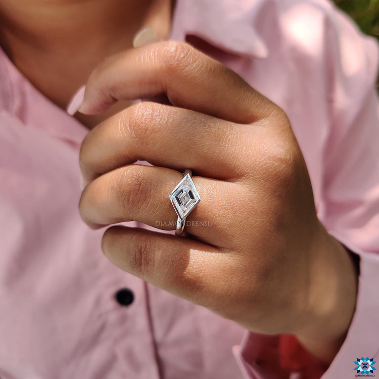 Solitaire setting showcasing a lozenge cut moissanite.