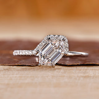 Hexagon diamond ring with round cut side stones in white gold.