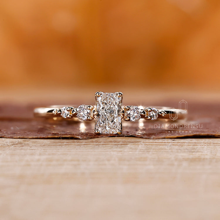 Lab Grown Diamond radiant cut engagement ring in yellow gold.