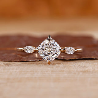 3 stone diamond ring with cushion and marquise stones.