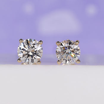 Classic round diamond stud earrings crafted for timeless style.