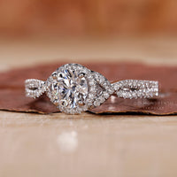 A stunning twisted halo engagement ring featuring a unique and elegant twist.