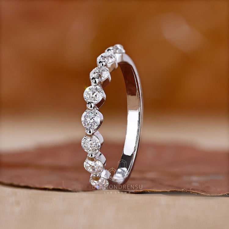 Half Eternity Band with diamonds encircling the band for beauty.