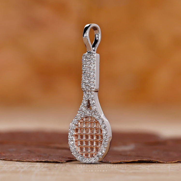 Custom diamond racket charm pendant with prong set and gold setting.